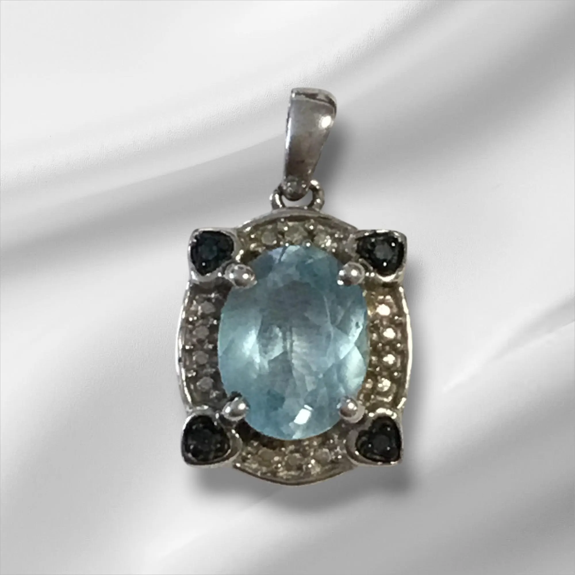 Sterling Silver Pendant w/Light Blue Stone